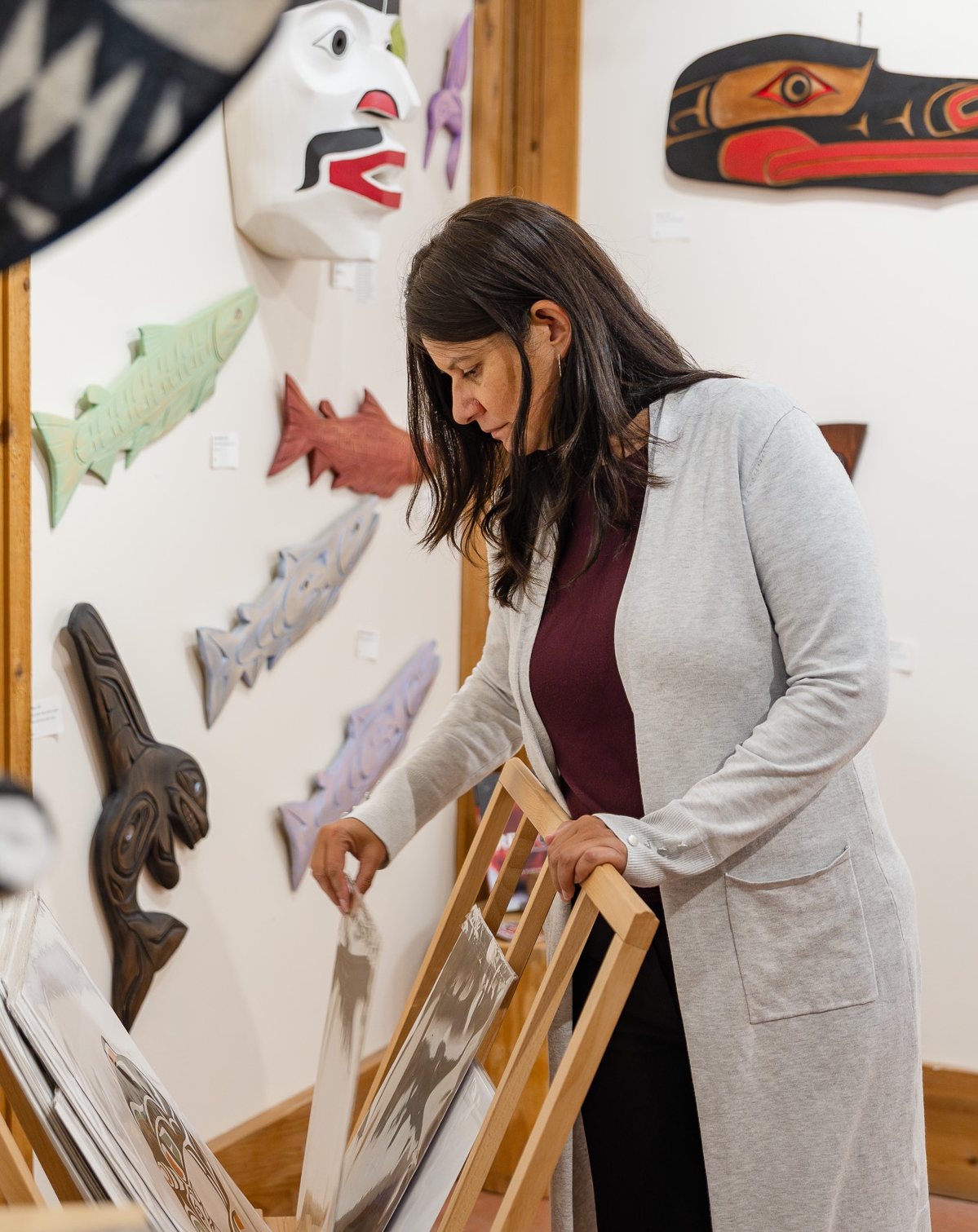 customer looking at art inside I-HOS gallery