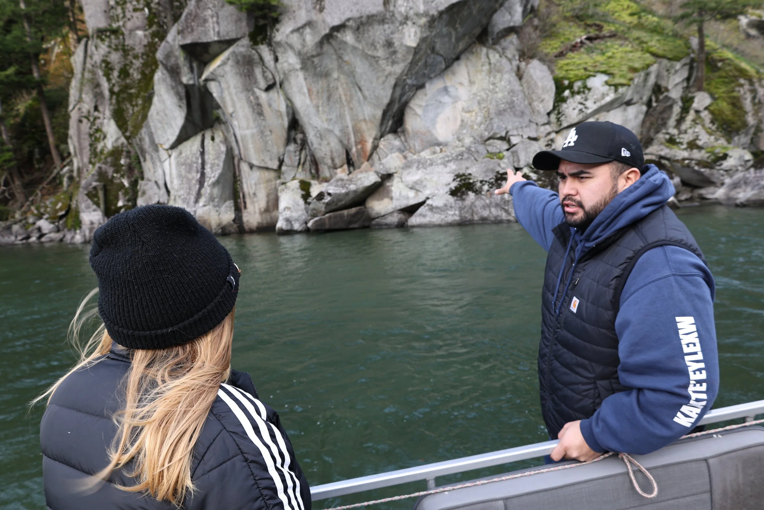 Guide on the Harrison lake, leading a boat tour and teaching guest with Sts'ailes Tours