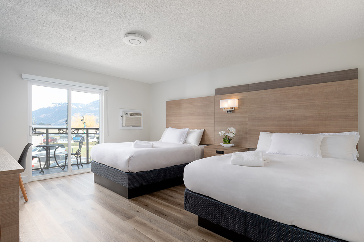 spacious and pristine guest room at Sqewqel Harrison Grand Motel, located downtown in Harrison Hot Springs. This room has a spectacular view of Harrison Lake.