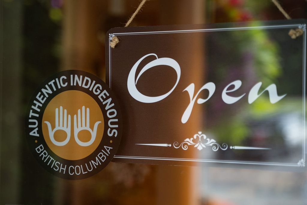 door to Ruby Creek Art Gallery in Agassiz with Open sign and Authentic Indigenous decal