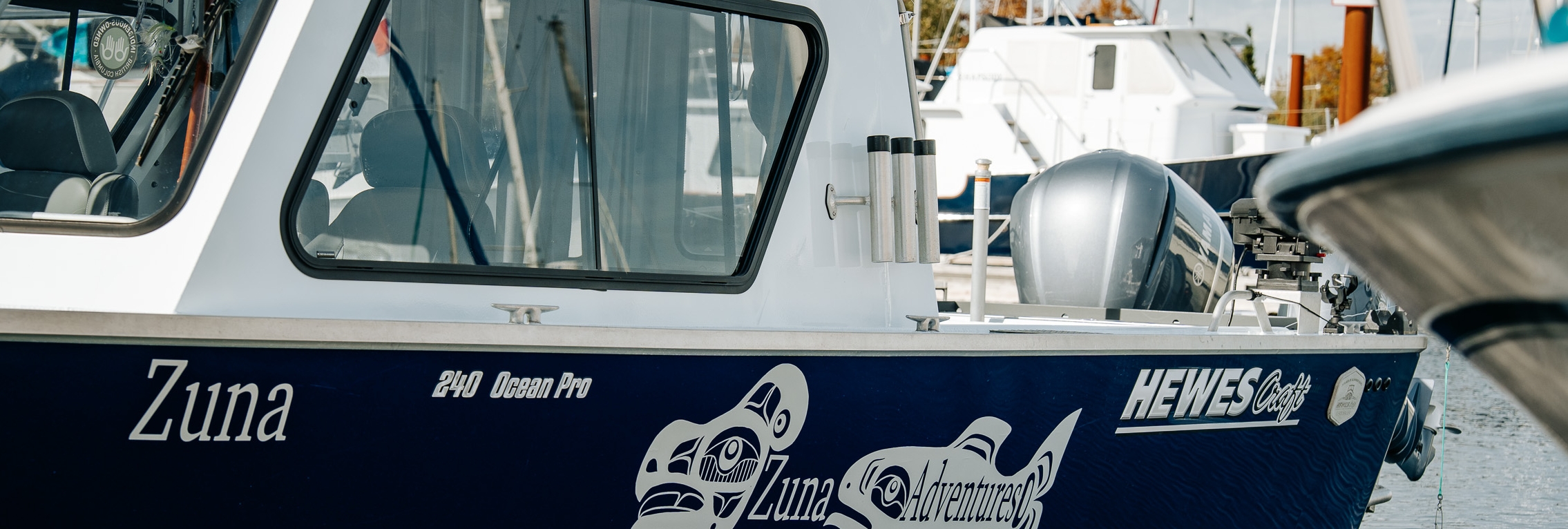 Zuna Adventures boat docked at marina