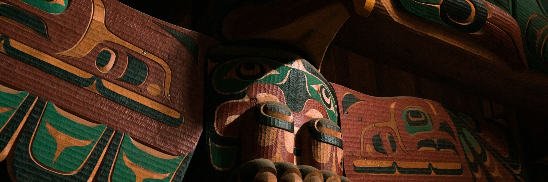 A closeup shot of a totem pole.