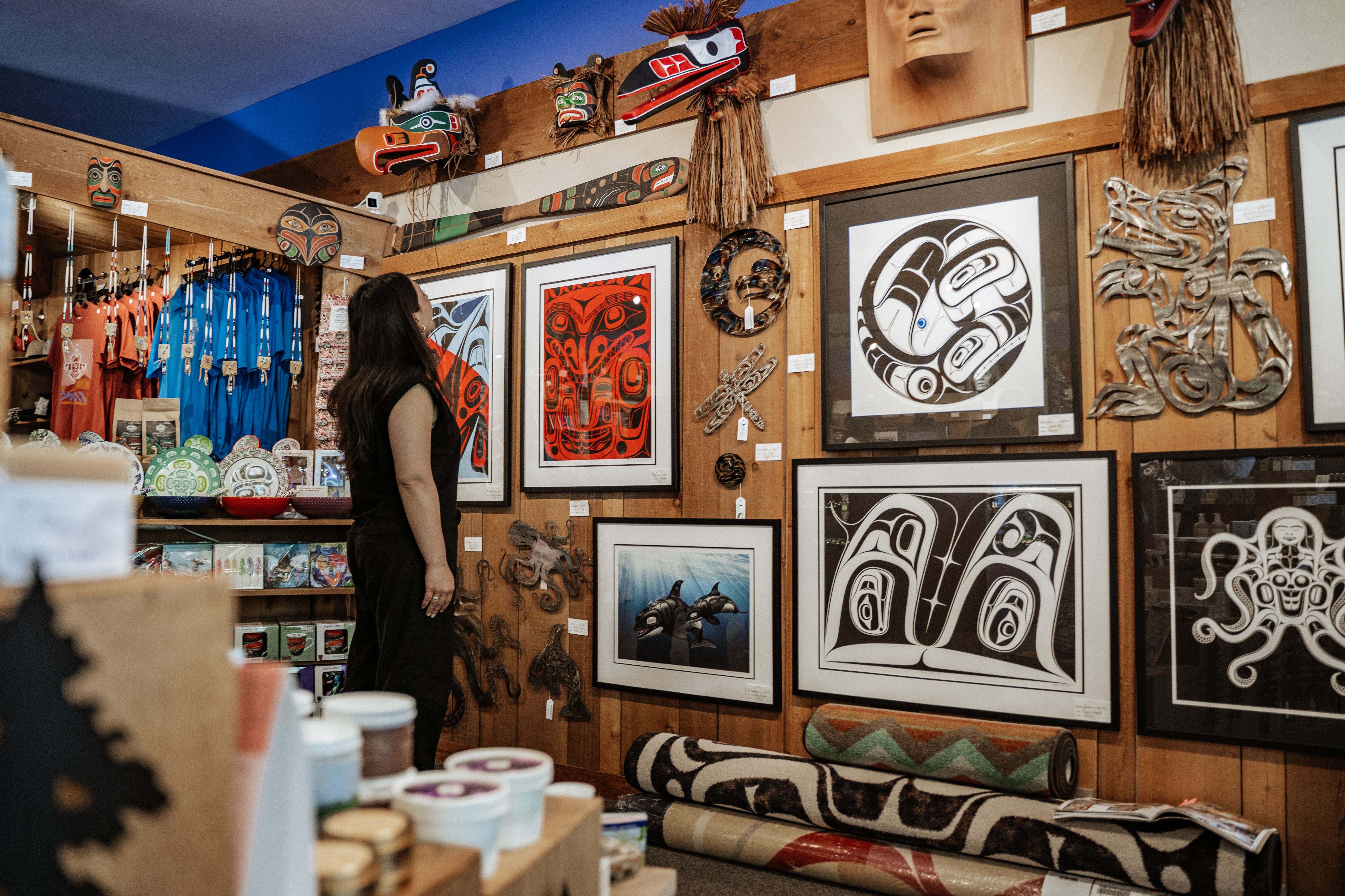 visitor shopping local authentic Indigenous art at Spirit Gallery in Horseshoe Bay, BC